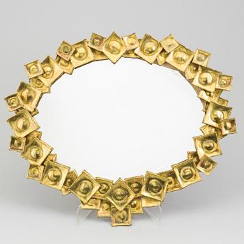 A brass mirror by Claës Giertta.