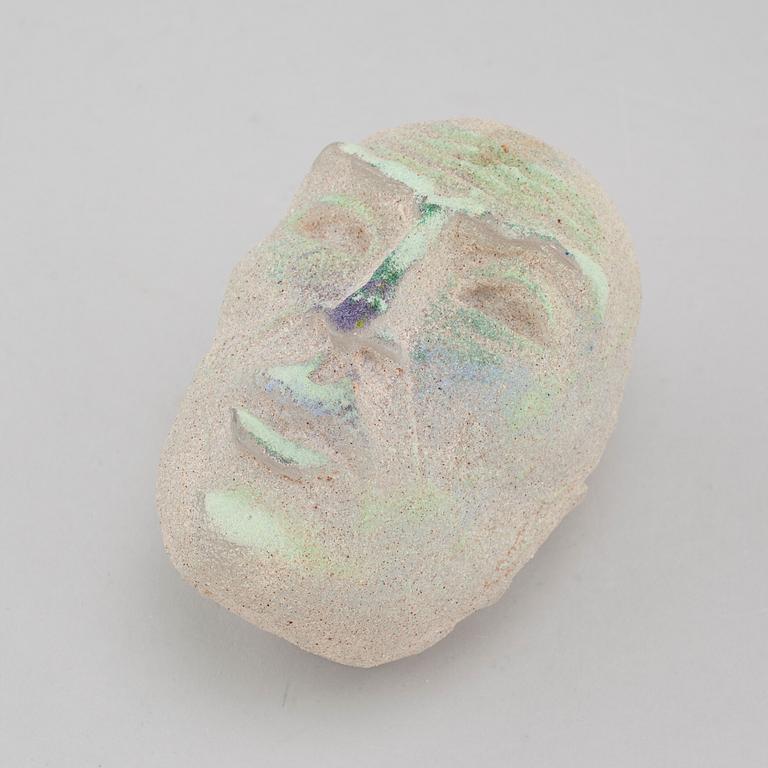 a glass object, signed.