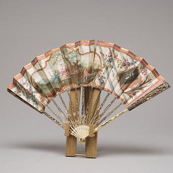 A set of four fans and a stand, 19th/20th Century.