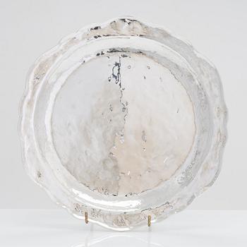 A 12-piece set of sterling silver chargers, Peru 1950s-60s.