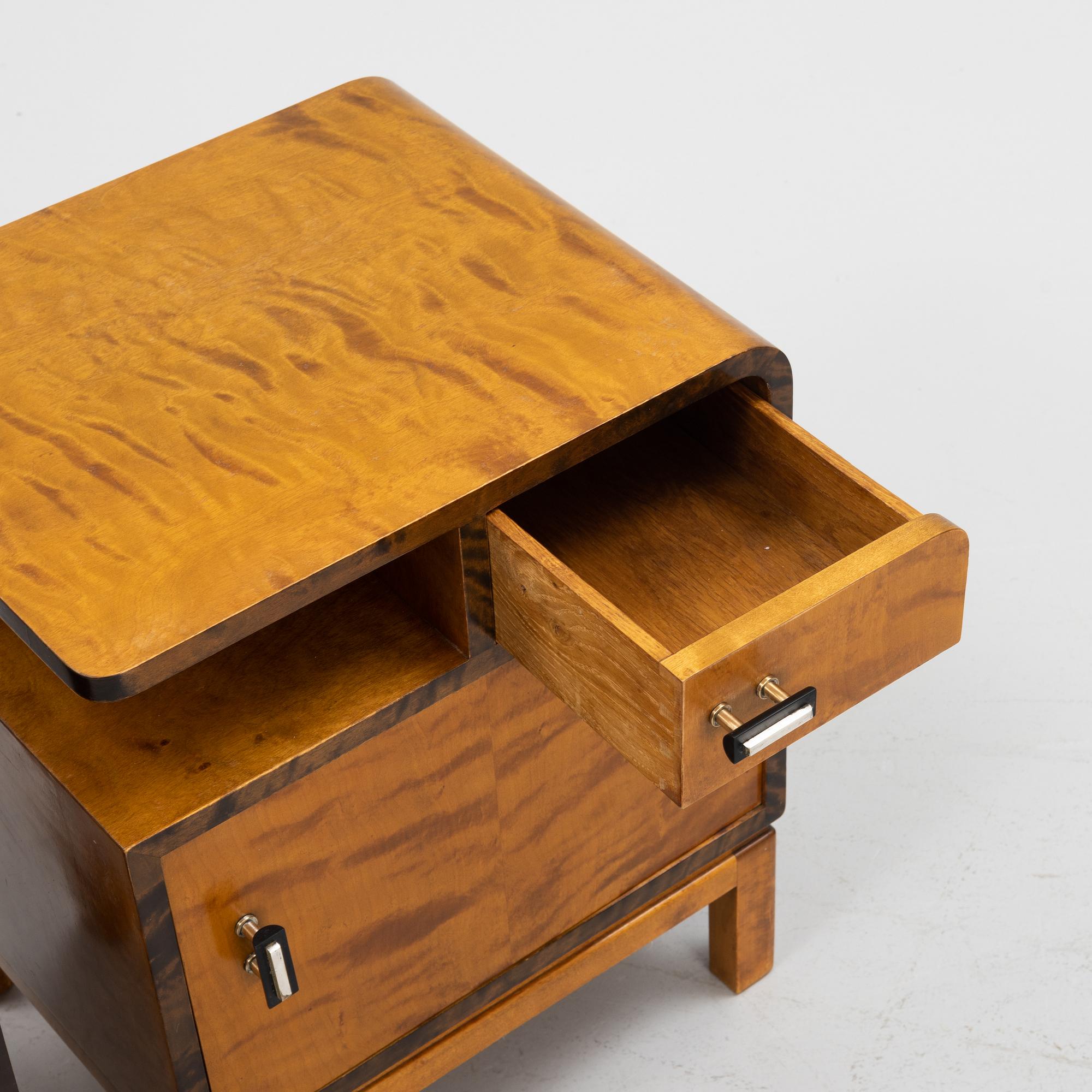 A pair of birch veneered 1930's bedside tables.