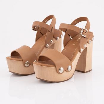 Prada, a pair of wood and leather sandals, size 37.