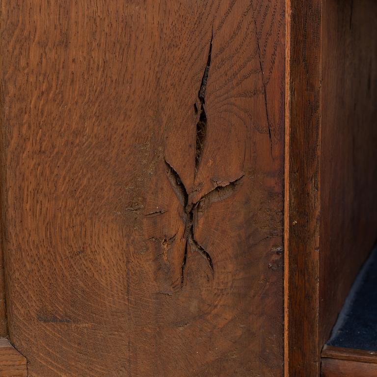 A mid 18th century rococo oak cabinet.