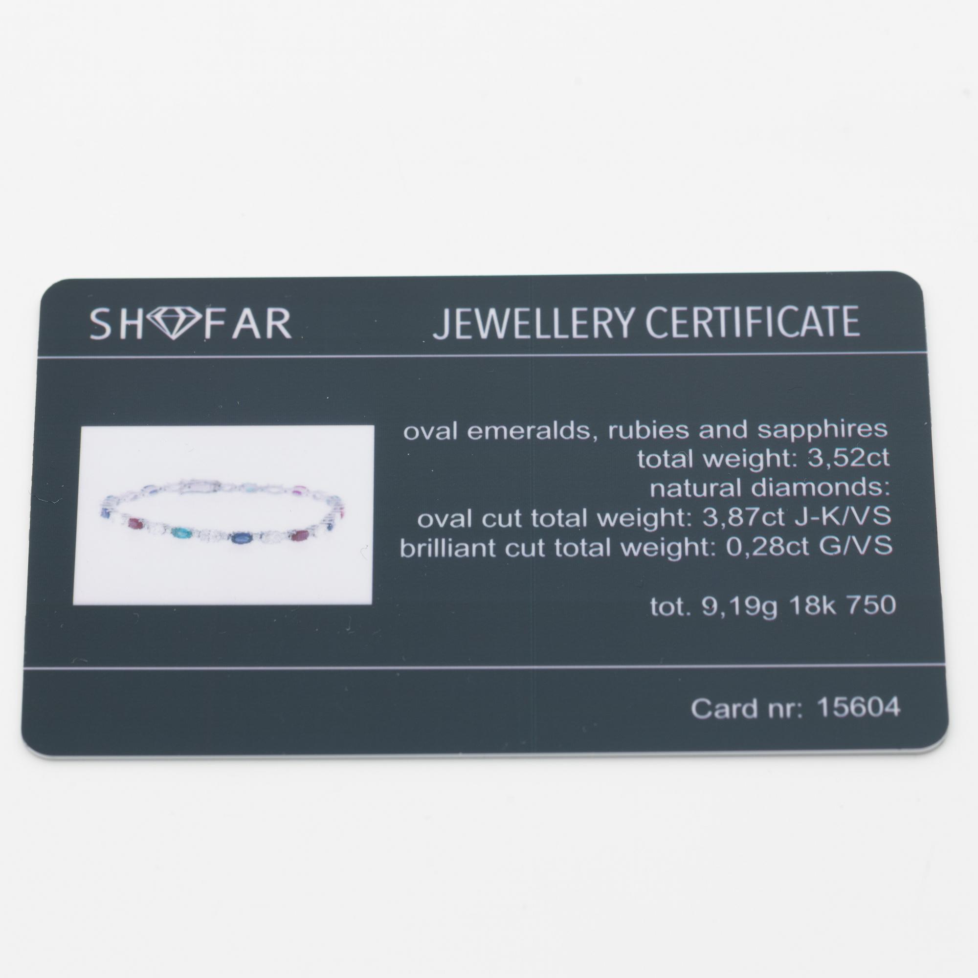 Bracelet 18K white gold set with faceted rubies, emeralds, sapphires, and round brilliant-cut diamonds.