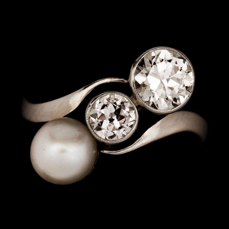 An old cut diamond and possibly natural blister pearl ring. Diamonds total carat weight circa 0.90ct.