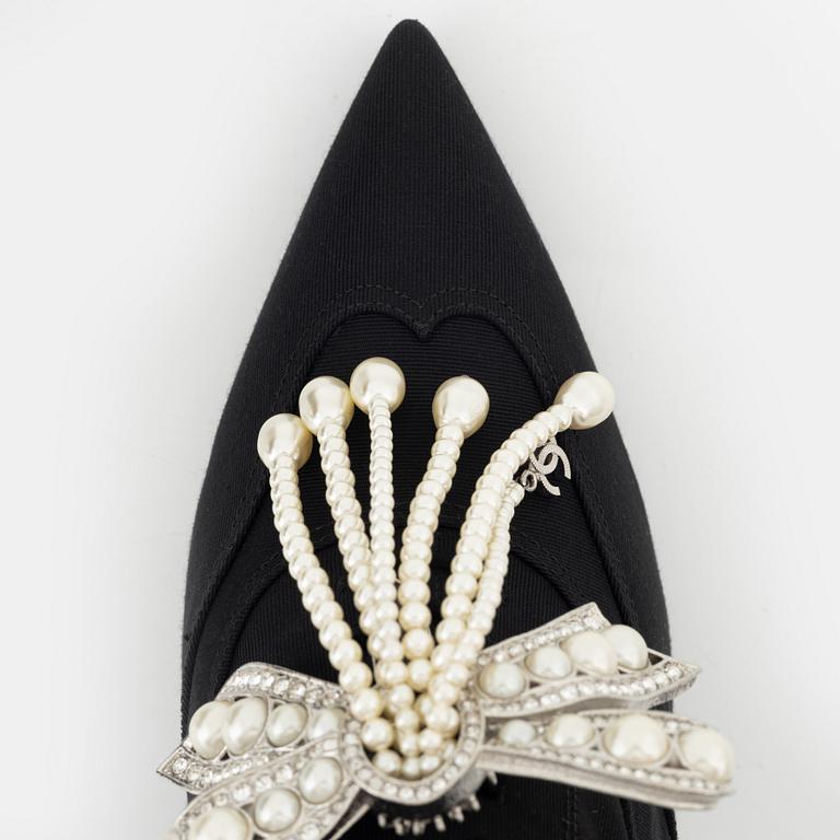 Chanel, a pair of pearl and strass bow pumps, size 37.