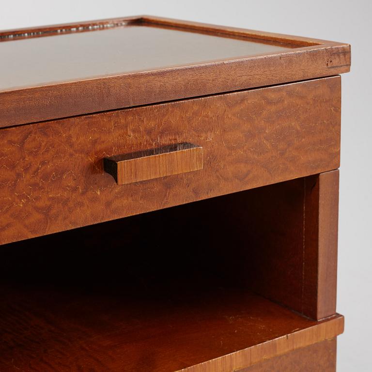 A pair of 1930's bedside tables.