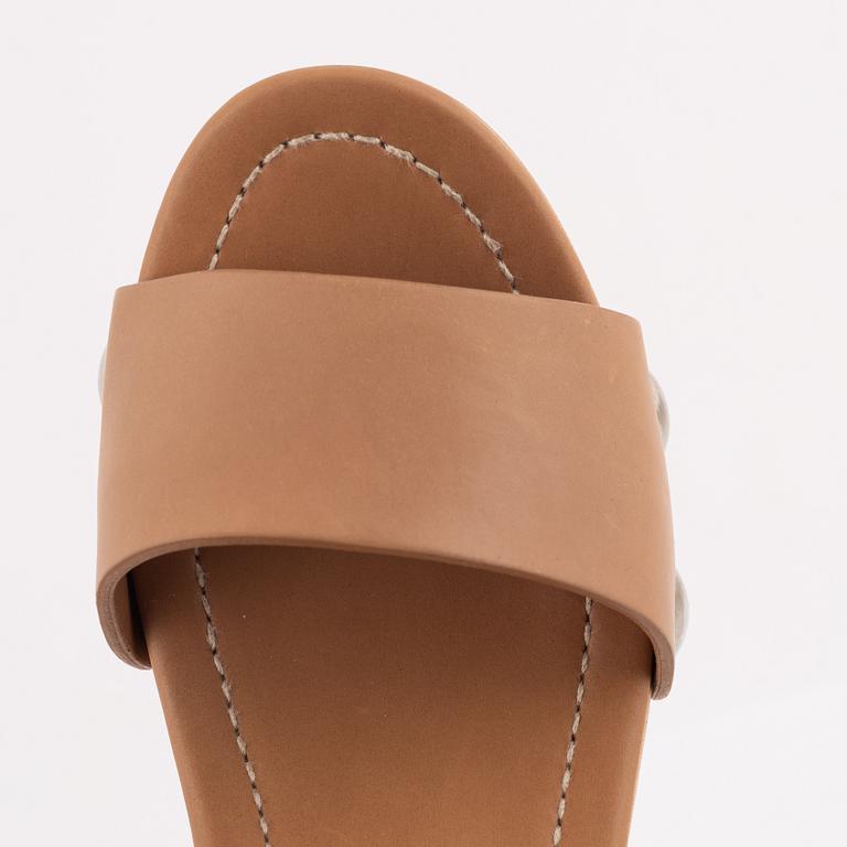 Prada, a pair of wood and leather sandals, size 37.