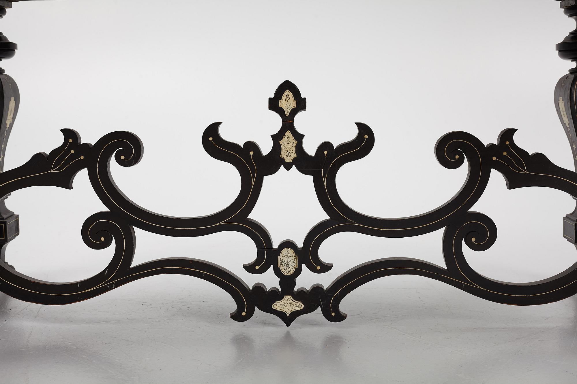 A Renaissance-style ebony, ebonized and ivory-inlaid library table, late 19th century, presumably Germany.