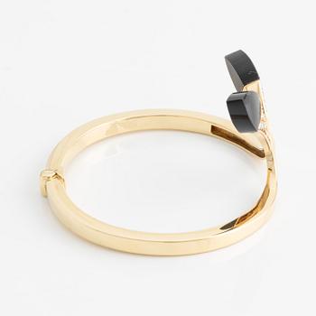 Bangle with onyx and brilliant-cut diamonds.