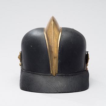 An early 20th century fireman helmet.