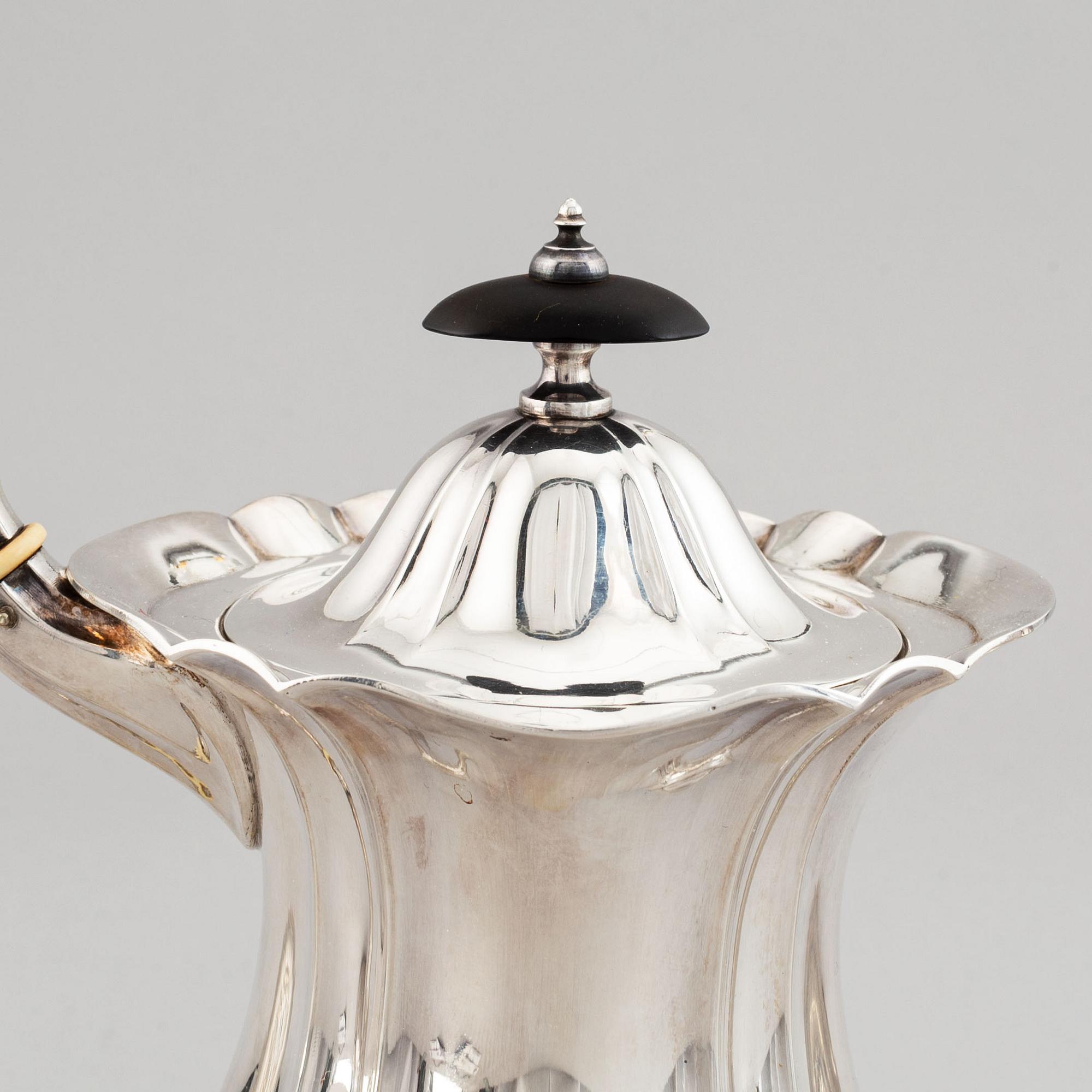 A swedish parcel-gilt coffee pot, creamer and suga bowl.