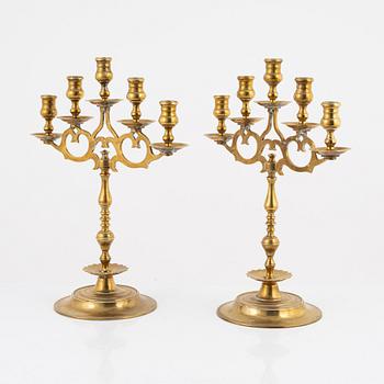 A pair of brass candelabras, early 20th century.