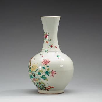 A famille rose vase, China, Republic, 20th Century, with Qianlong four character mark in red.