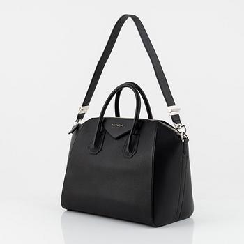 Givenchy, a black leather 'Antigona' bag.
