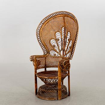 A RATTAN ARMCHAIR.