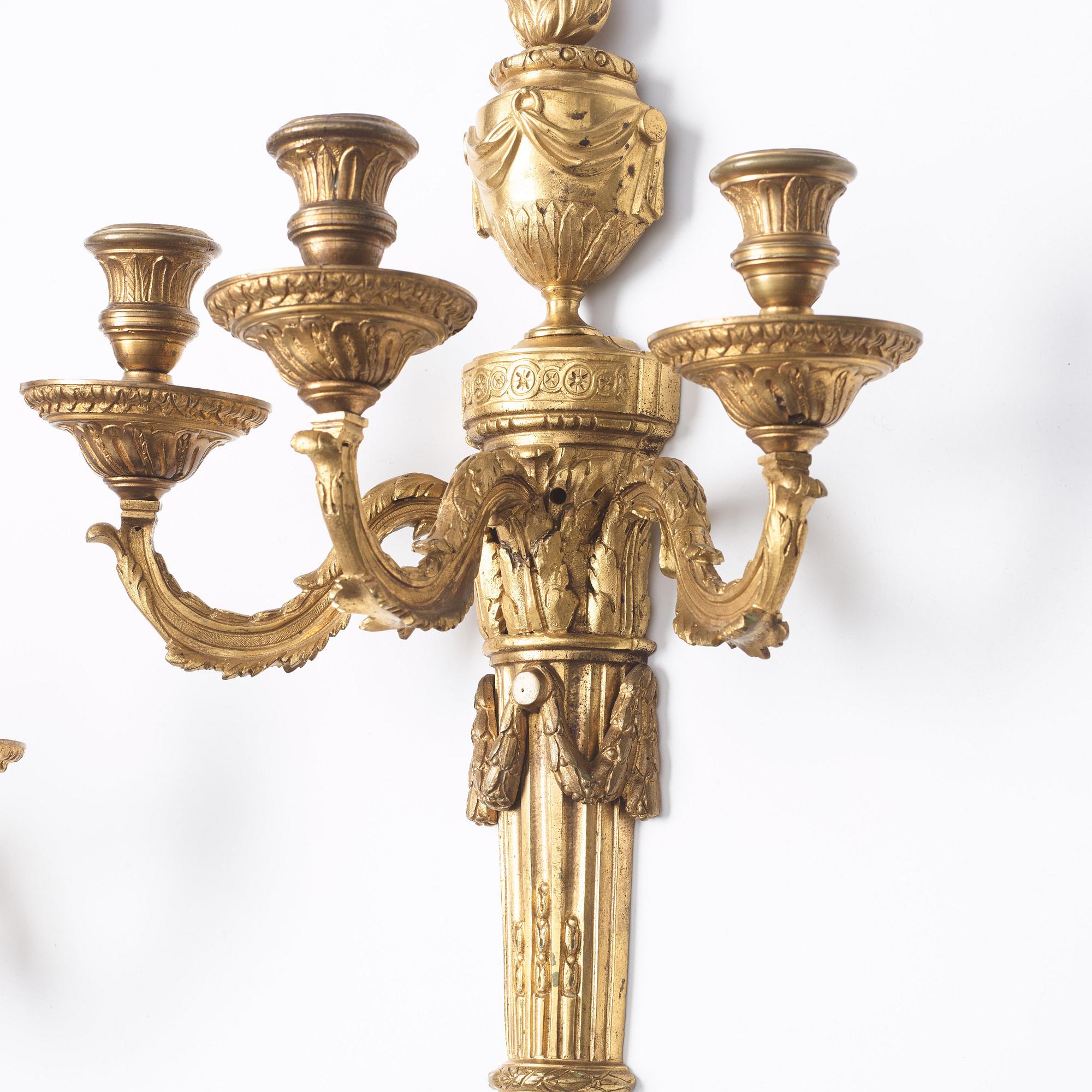 A pair of presumably Gustavian three-light wall-lights, late 18th century.