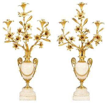 949. A pair of Louis XVI-style 19th century three-light candelabra.