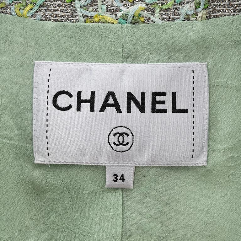 Chanel, a green and silver bouclé jacket, 2018, French size 34.