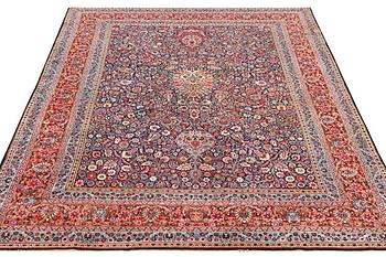 A semi-antique Meshad carpet, a. 360 x 252 cm.