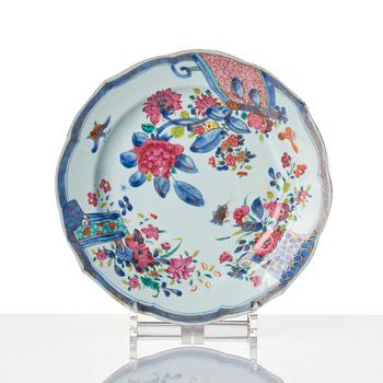 A set of 12 famille rose dinner plates, Qing dynasty, Qianlong (1736-95).