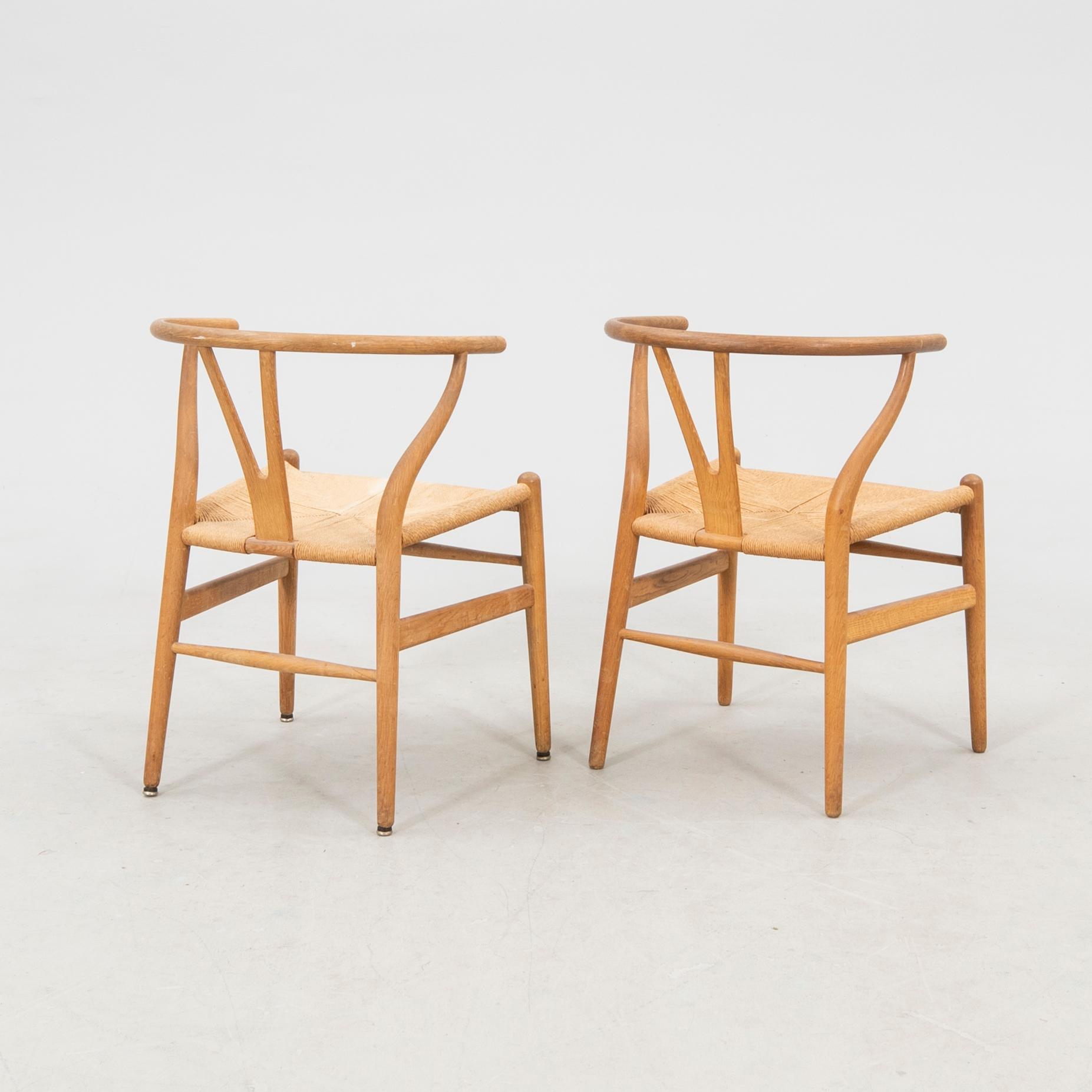 Hans J. Wegner, chairs, a pair, "The Y-Chair", model CH-24, Carl Hansen & Søn, Denmark.