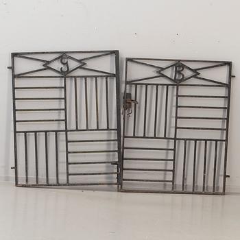 A pair of cast iron gates from the first half of the 20th Century.