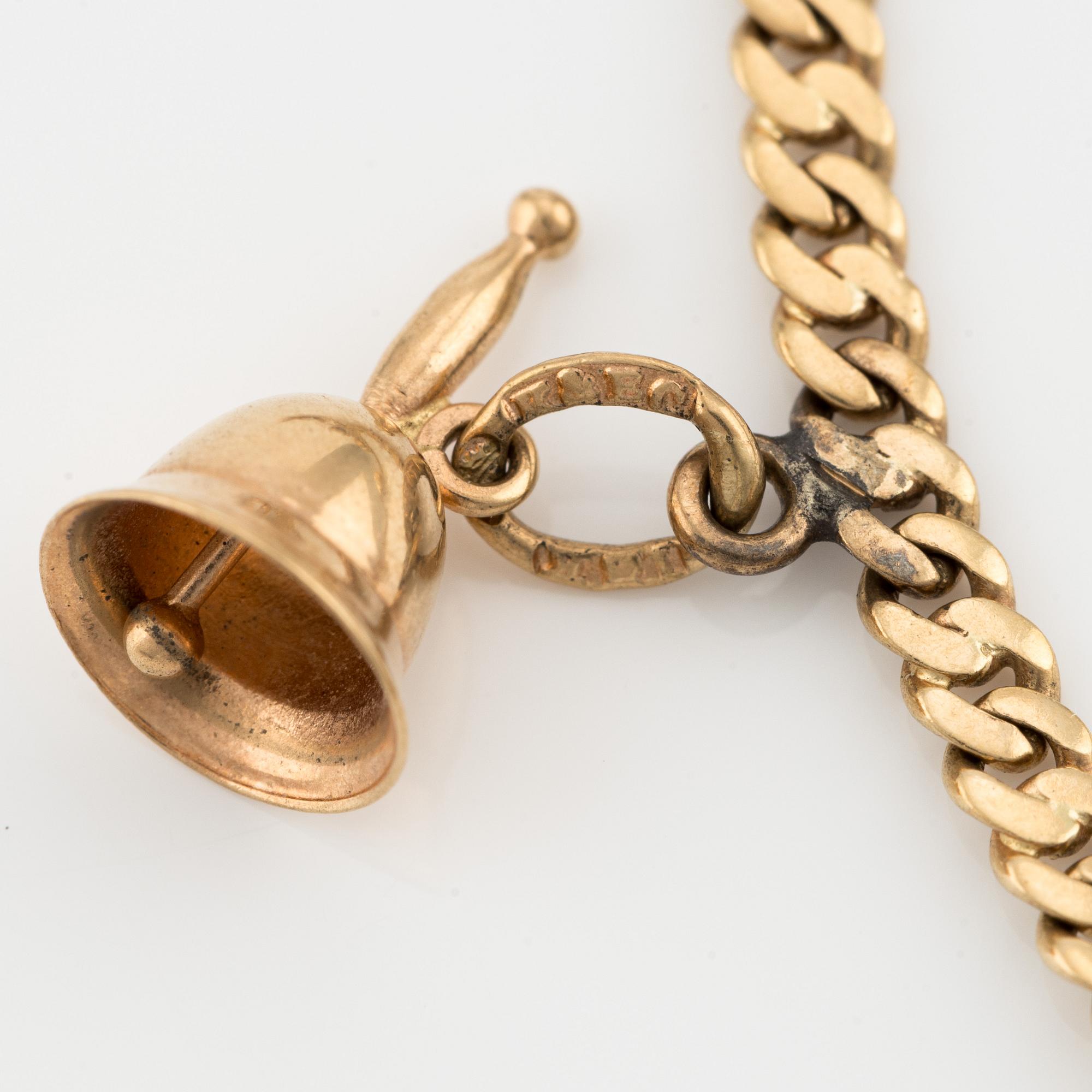 Bracelet 18K gold with charms.