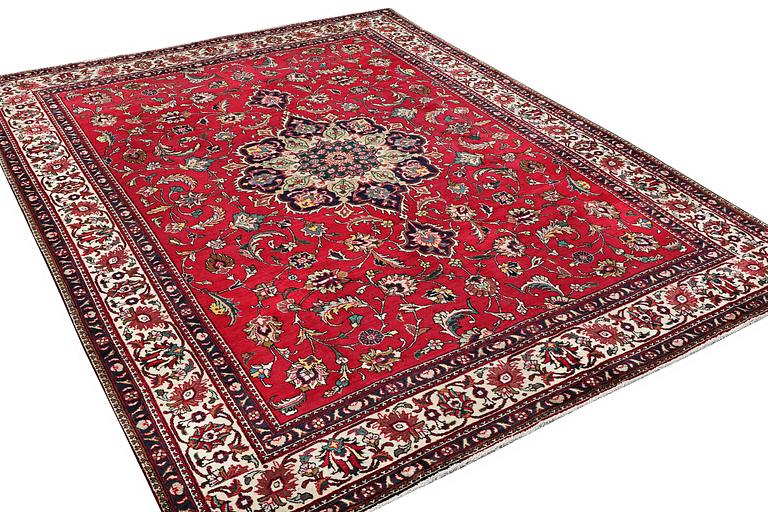 A Tabriz carpet, c. 385 x 300 cm.