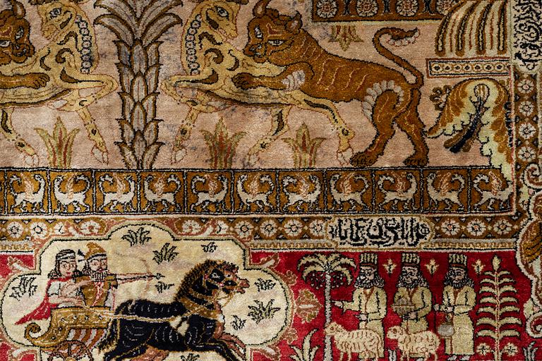 A pictorial semi-antique silk Qum rug, central Persia, c. 214 x 146 cm.