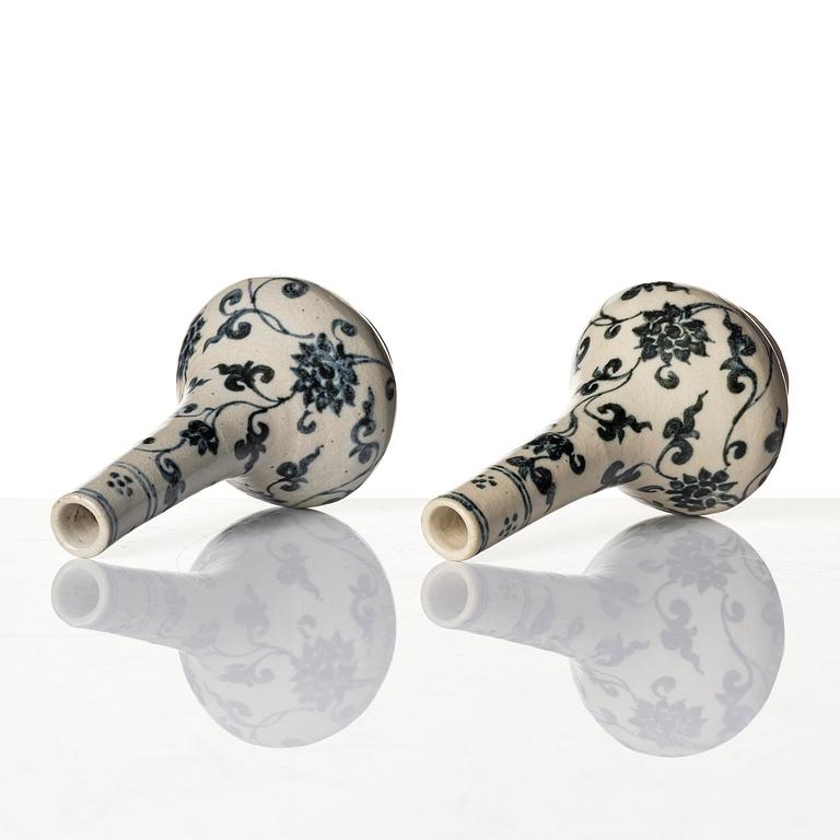 A pair of blue and white lotus vases/water sprinklers, Ming dynasty (1368-1644).