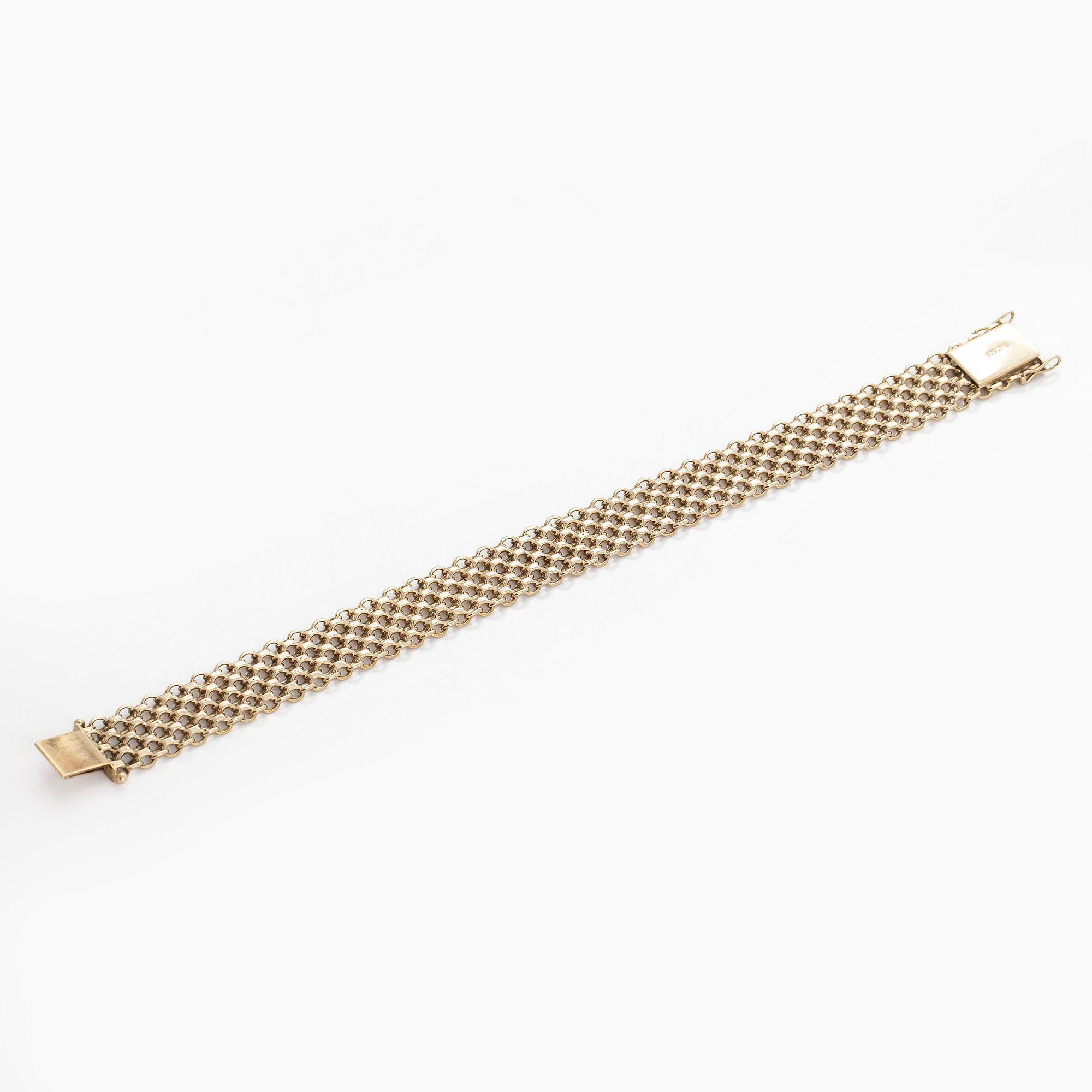 A 14K gold X-link bracelet, likely Norway.