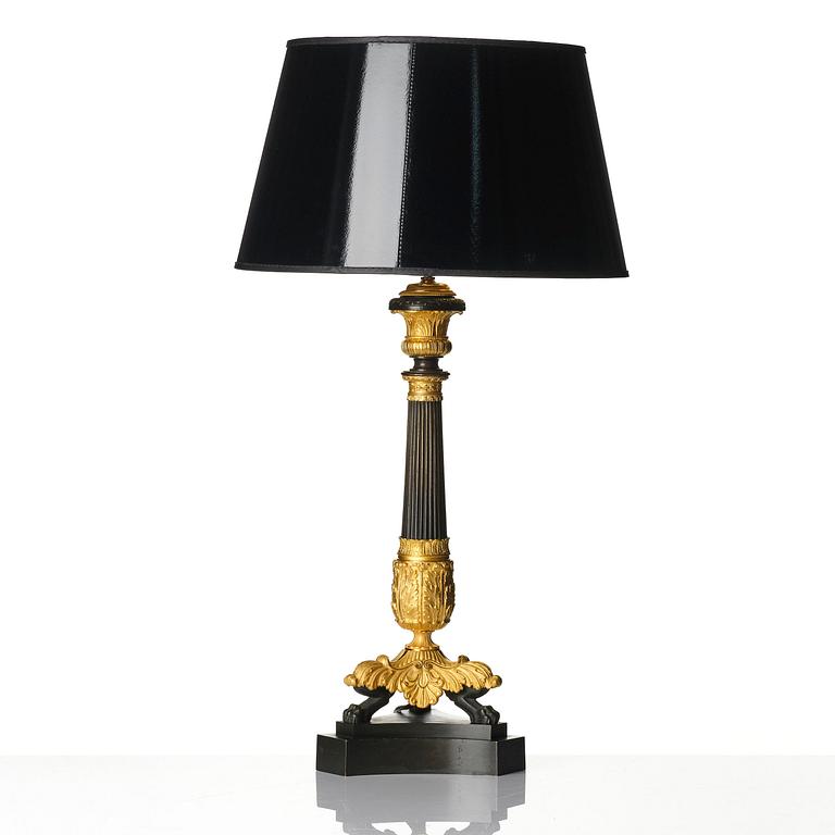A French Louis Philippe ormolu and patinated bronze lamp, first part 19th century.