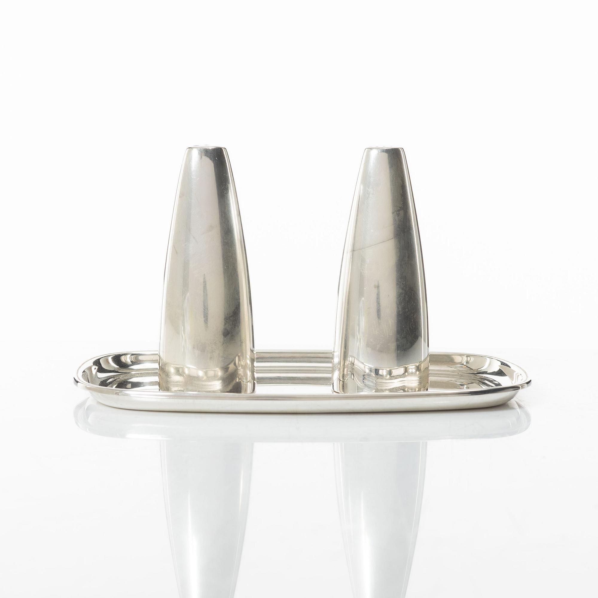 Salt and pepper shakers and tray, silver, including Henning Koppel for Georg Jensen, Denmark.