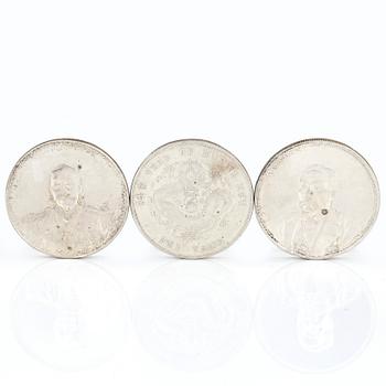 A group of three Chinese silver coins, Guangxu (1908), and two from the Republic era (1912-1949).