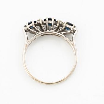 Ring, 18K white gold, set with three sapphires and single-cut diamonds.