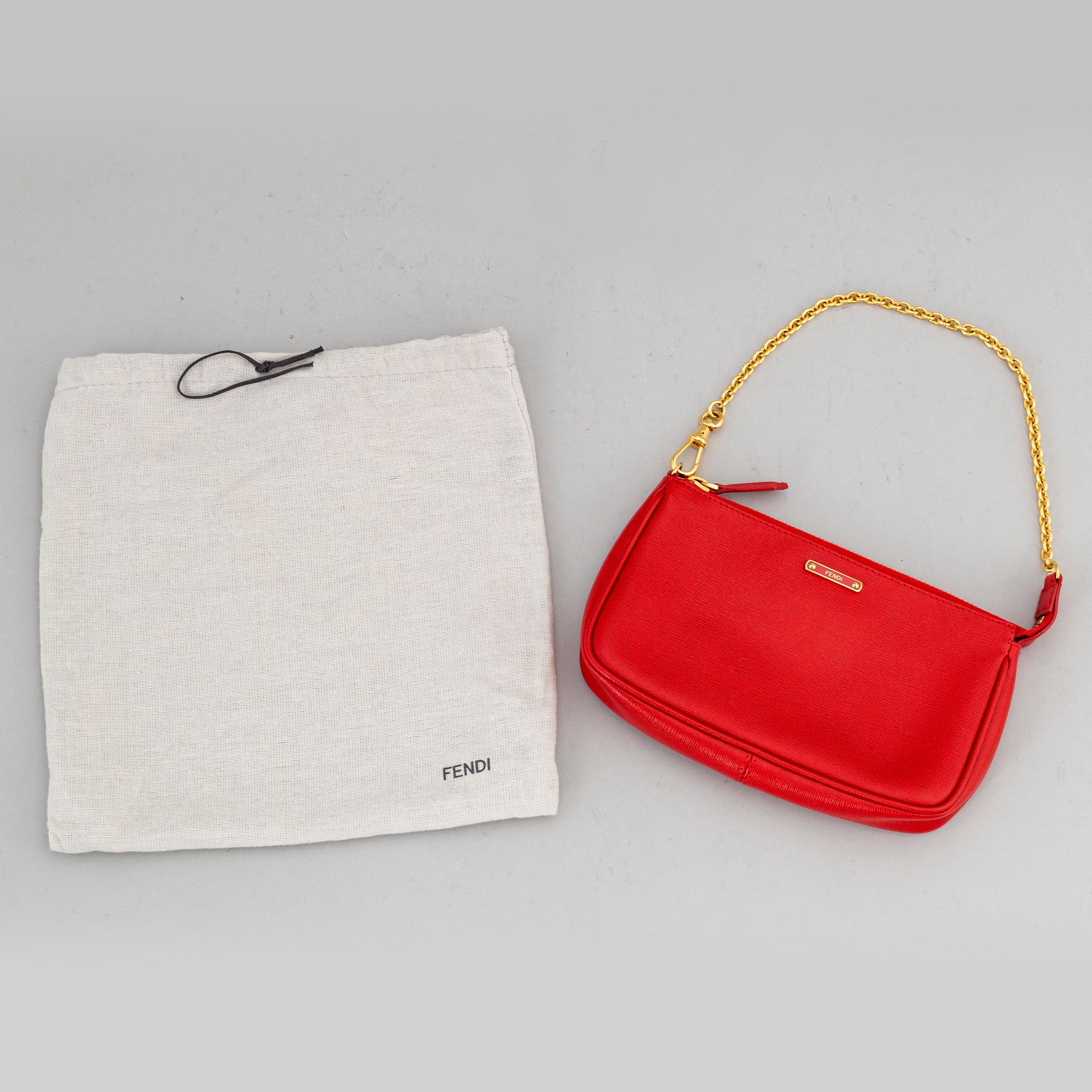 FENDI, a red hand bag.