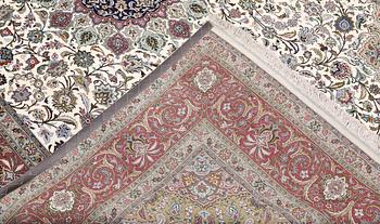 A part silk Tabriz carpet, 310 x 205 cm.