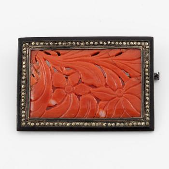 Brooch in silver with coral and marcasites, and with black details.