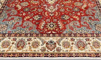 A Tabriz carpet, approx. 343 x 245 cm.