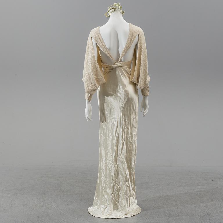 A satin wedding dress, circa 1935.