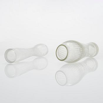 Tapio Wirkkala, four line-cut clear glass vases, signed Tapio Wirkkala Iittala.