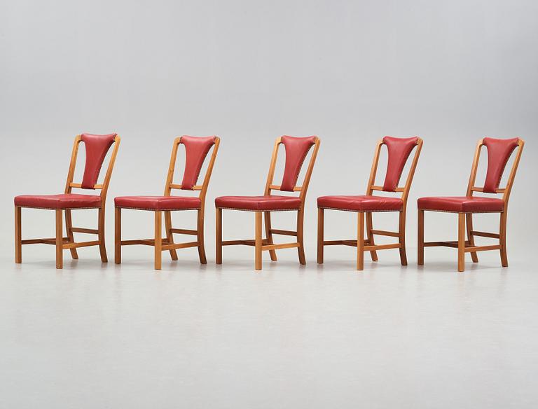 Josef Frank, a set of five walnut and red leather dining chairs, Svenskt Tenn, model 2229, mid 20th century.