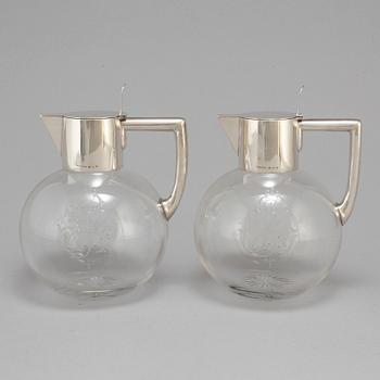 A pair of caraffes with silver mountings by CG Hallberg, Stockholm 1890.