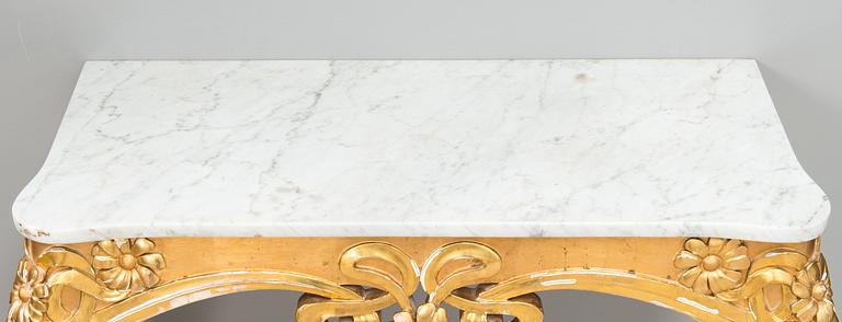 An Art Nouveau mirror with console table from early 20th century.