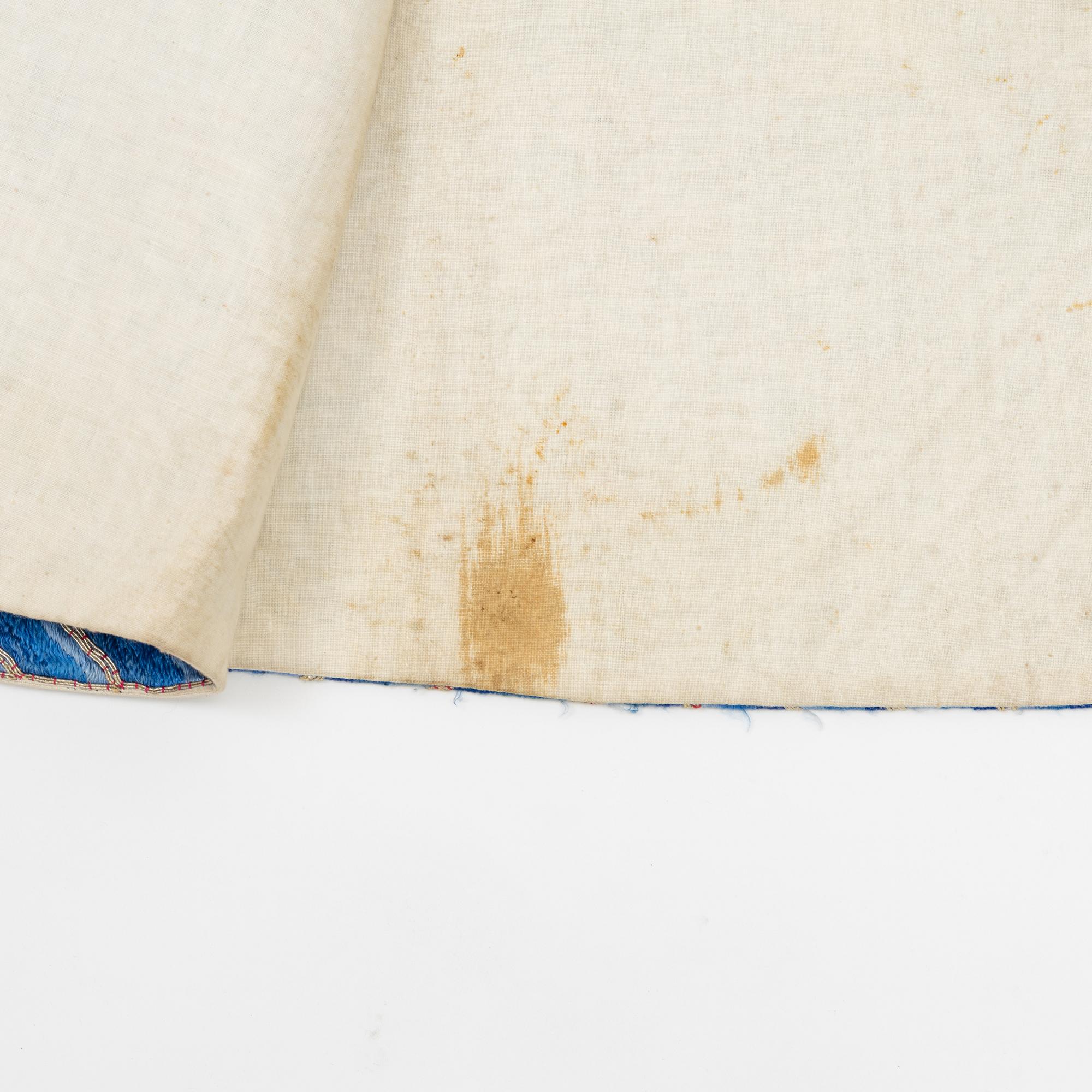 A yellow-ground embroidered silk robe, 20th century.