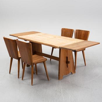 A pine dining group, table and four chairs, by Göran Malmvall for Svensk Fur, mid/second hald of the 20th century.