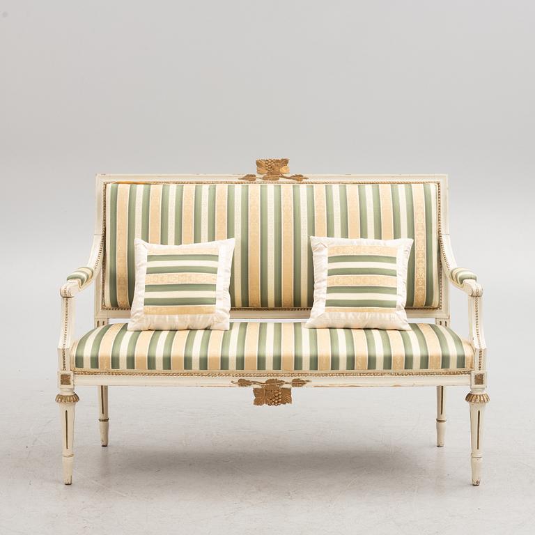 A Gustavian style sofa, early 20th century.