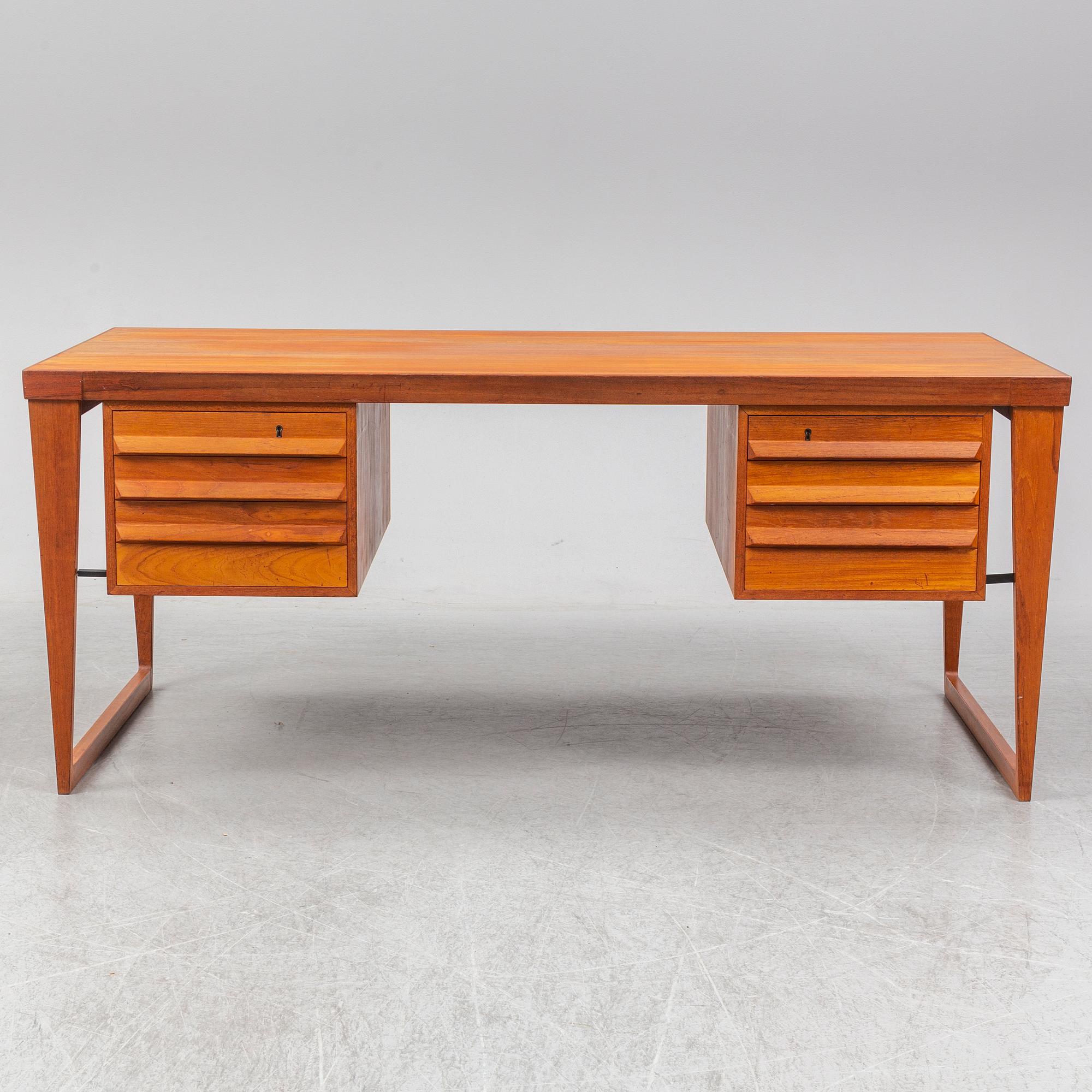A 1960's teak model 70 writing desk by Kai Kristiansen.