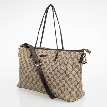 Gucci, a canvas tote bag.